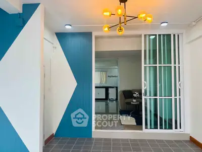 Modern living room with stylish lighting and sliding glass doors