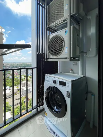 Modern balcony with washing machine and air conditioning unit, offering a stunning city view.