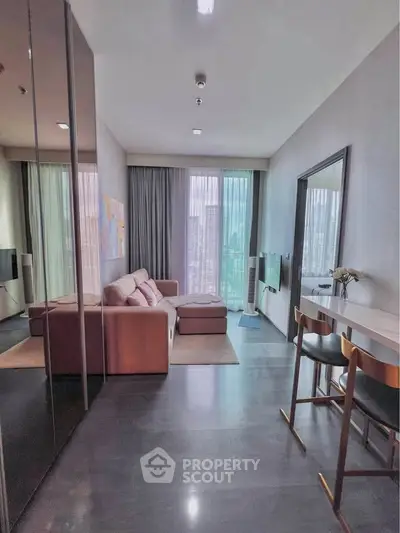 Modern living room with cozy sofa and city view through large windows, perfect for urban living.