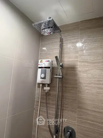 Modern bathroom with sleek shower and water heater installation.