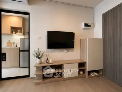 Modern living room with sleek wooden furniture and open kitchen view