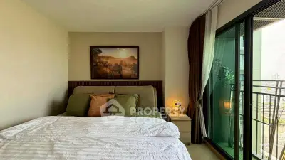 Cozy bedroom with balcony view in modern apartment