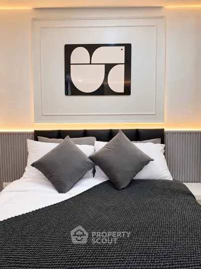 Modern bedroom with stylish decor and cozy bedding