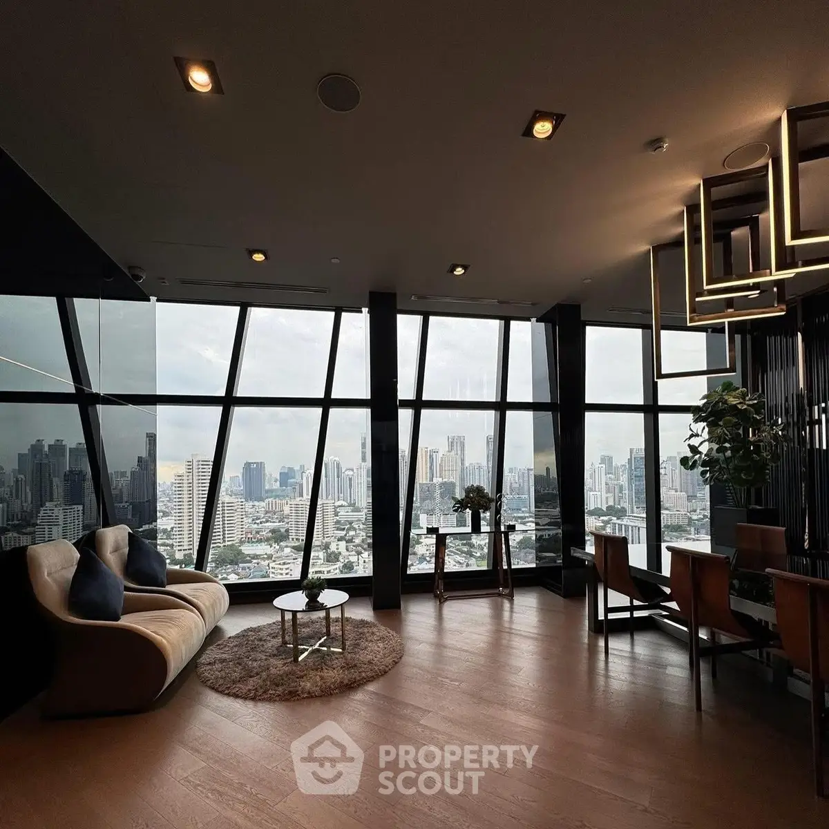 Luxurious living room with panoramic city views and modern furnishings.