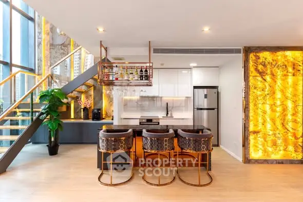 Luxurious modern kitchen with stylish bar stools and elegant lighting