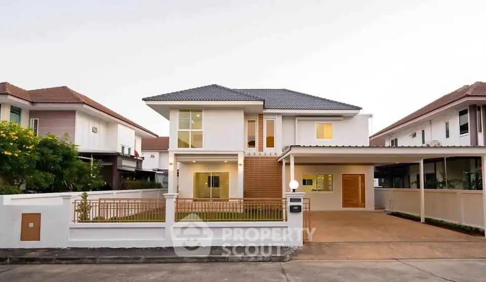 Stunning modern two-story house with spacious driveway and elegant facade in a serene neighborhood.