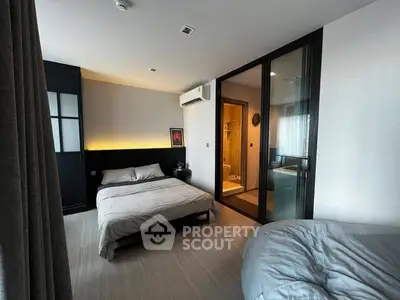 Modern bedroom with ensuite bathroom and cozy decor