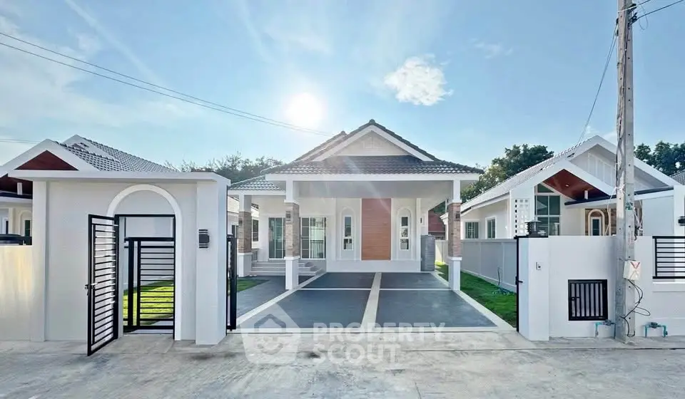 Stunning modern house with spacious driveway and elegant entrance in a serene neighborhood.