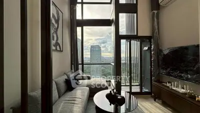 Luxurious high-rise living room with floor-to-ceiling windows and stunning city view.