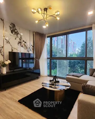 Modern living room with stylish decor and large window view