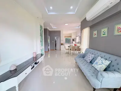 Spacious and elegant living room with modern decor and open layout, perfect for family gatherings.