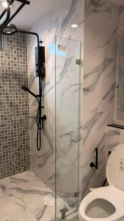 Modern bathroom with marble tiles and sleek shower design