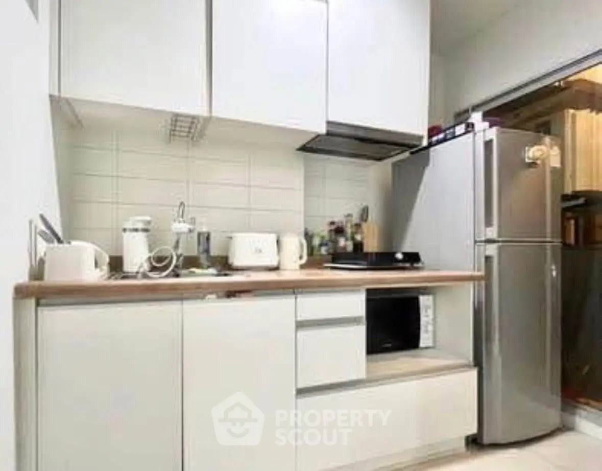 Modern kitchen with sleek cabinets and stainless steel appliances