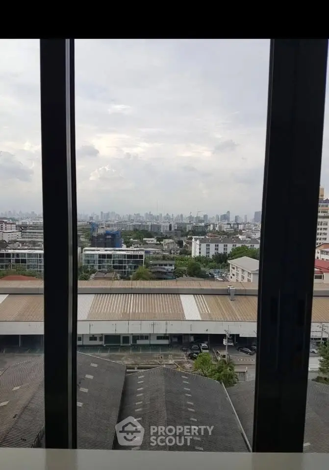 Stunning cityscape view from a high-rise window, showcasing urban skyline and expansive horizon.