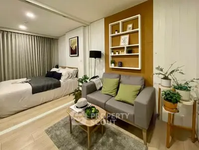 Modern studio apartment with cozy living area and stylish decor