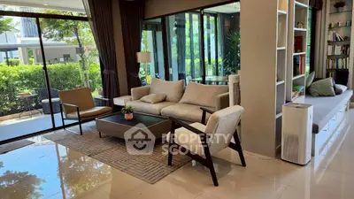 Spacious living room with modern furniture and garden view, perfect for relaxation and entertaining.