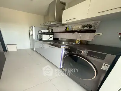 Modern kitchen with sleek appliances and ample storage space