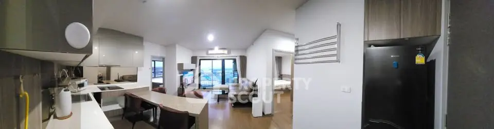 Spacious modern apartment with open kitchen and living room, featuring large windows and a scenic view.