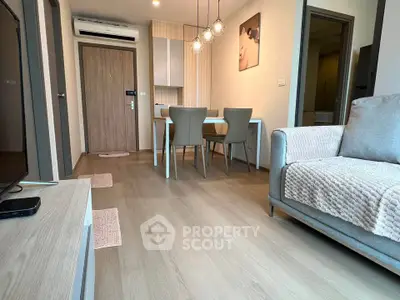 Modern living room with stylish dining area and cozy seating in a contemporary apartment.