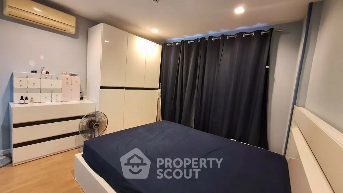 Cozy bedroom with modern furniture and ample storage space
