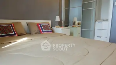 Modern bedroom with stylish decor and ample natural light