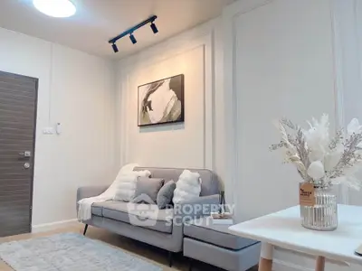 Stylish modern living room with cozy gray sofa and elegant decor