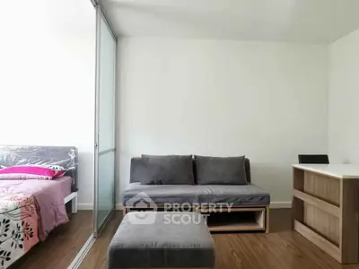 Modern studio apartment with cozy living area and stylish decor