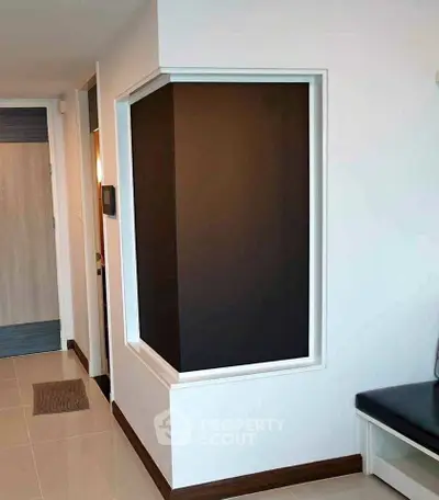 Modern apartment entrance with sleek design and neutral tones