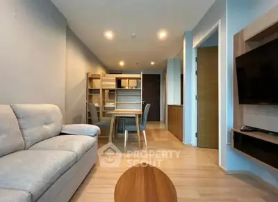 Modern living room with cozy sofa and stylish wooden furniture in a contemporary apartment.