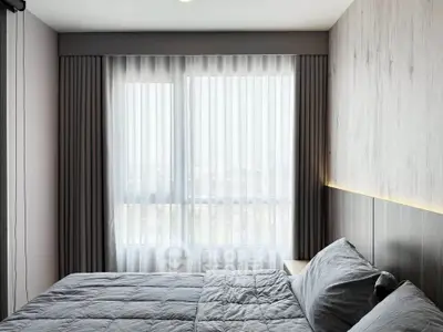 Modern bedroom with large window and stylish decor