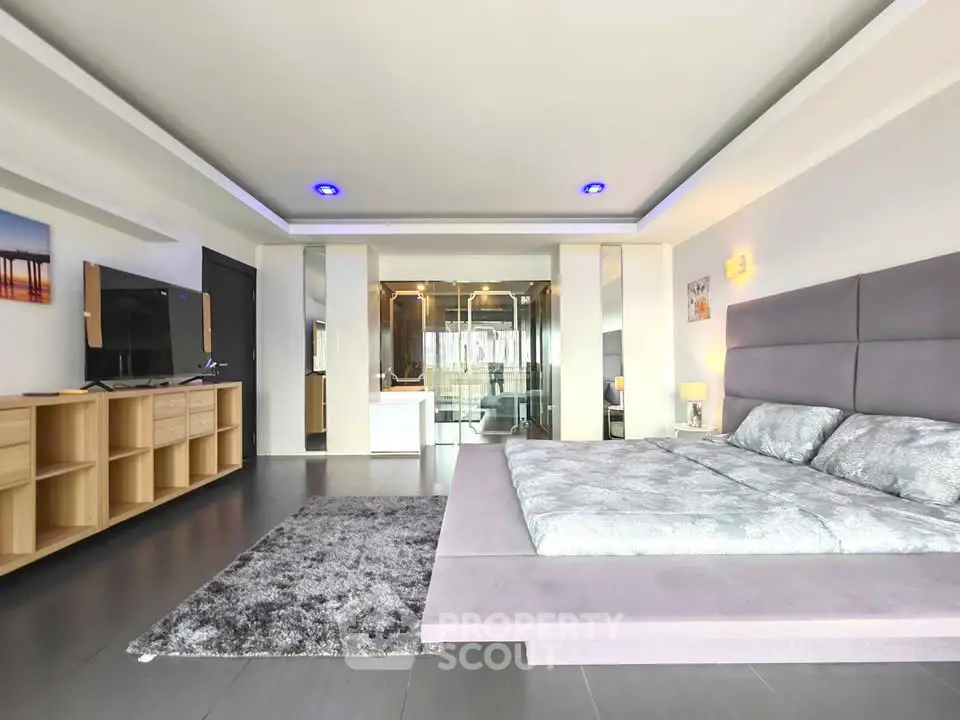 Luxurious modern bedroom with sleek design and ambient lighting
