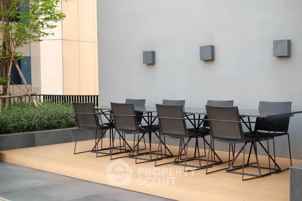 Modern outdoor dining area with sleek furniture and minimalist design