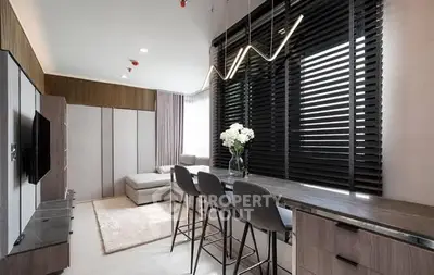 Modern living room with sleek design and stylish lighting in a contemporary apartment.