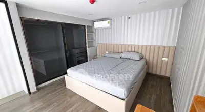 Modern bedroom with stylish decor and large bed in a contemporary apartment.