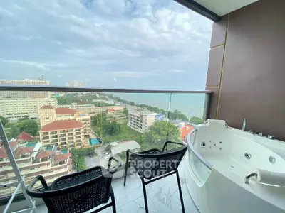 Luxurious balcony with jacuzzi and stunning ocean view in high-rise apartment