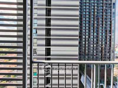 Modern urban balcony with cityscape view and sleek railing design.
