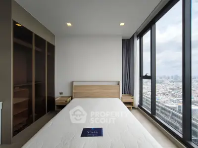 Modern bedroom with panoramic city view and sleek design