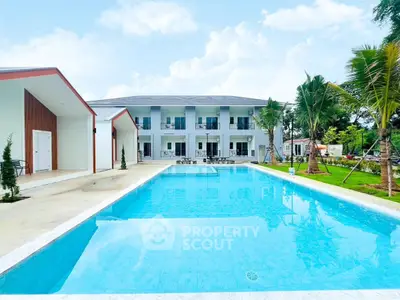 Luxurious modern villa with stunning pool and lush garden, perfect for relaxation and entertainment.