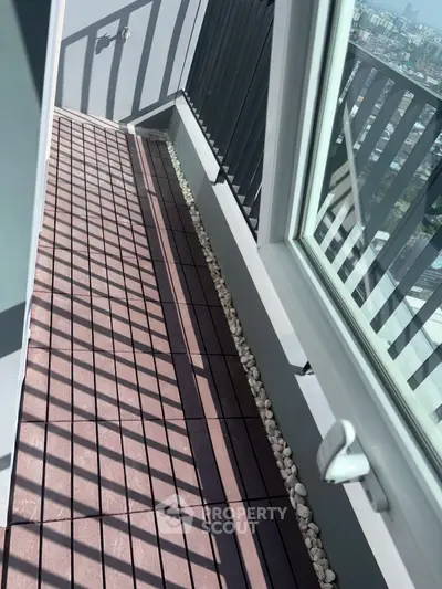 Modern balcony with sleek railing and city view, perfect for urban living.