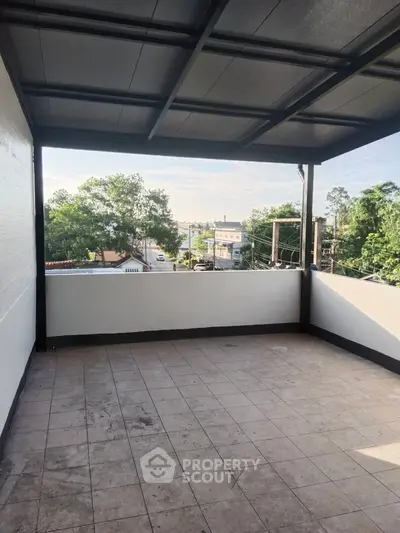 Spacious balcony with scenic view and tiled flooring, perfect for relaxation.