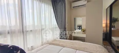 Bright and cozy bedroom with large window and modern decor