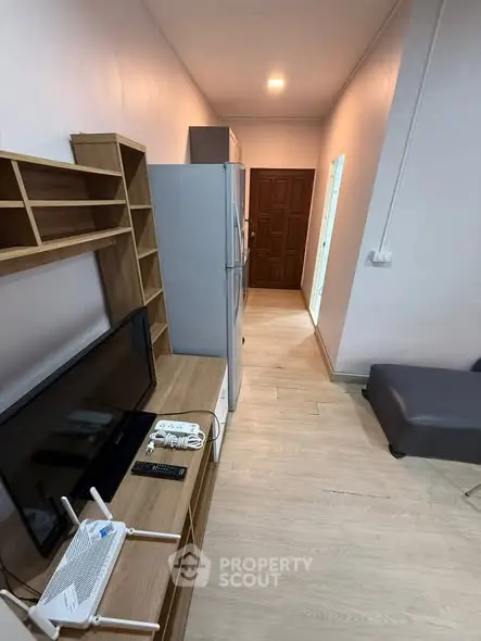 Modern apartment interior with sleek furniture and wooden flooring