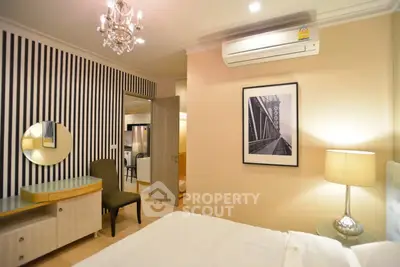 Elegant bedroom with modern decor and air conditioning in stylish apartment.