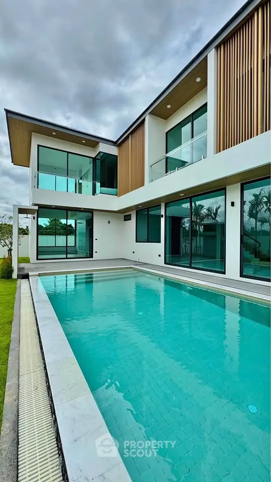 Luxurious modern home with stunning pool and elegant architecture, perfect for upscale living.