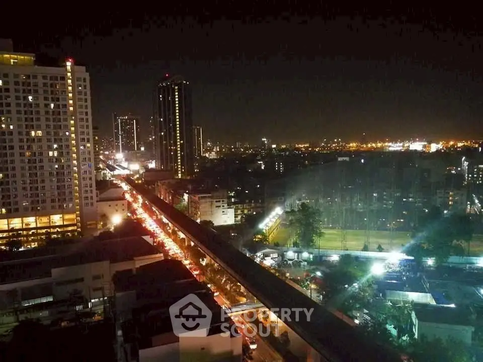 Stunning cityscape night view with illuminated skyline and bustling streets.