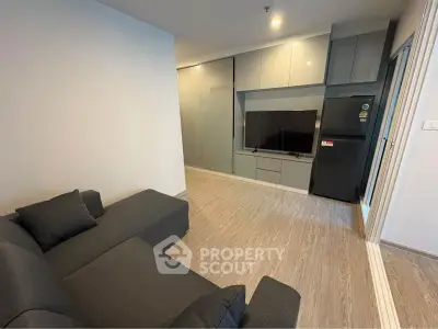 Modern living room with sleek furniture and built-in entertainment center
