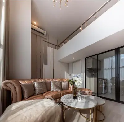 Luxurious modern living room with high ceiling and elegant decor in a stylish apartment.