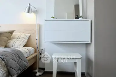 Modern bedroom with stylish decor and cozy lighting