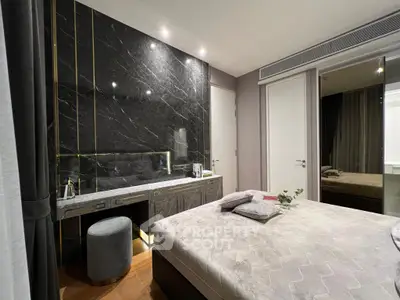 Luxurious bedroom with elegant marble accent wall and stylish decor
