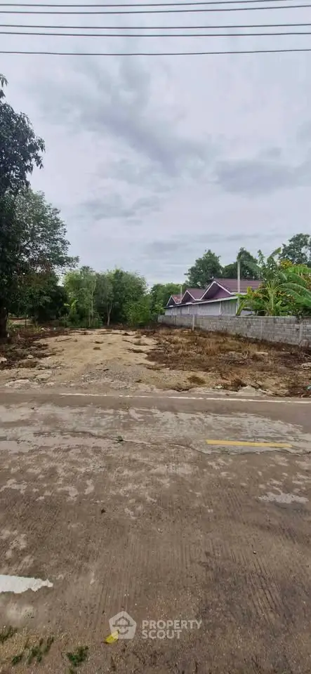 Spacious land plot with potential for development in a serene neighborhood setting.
